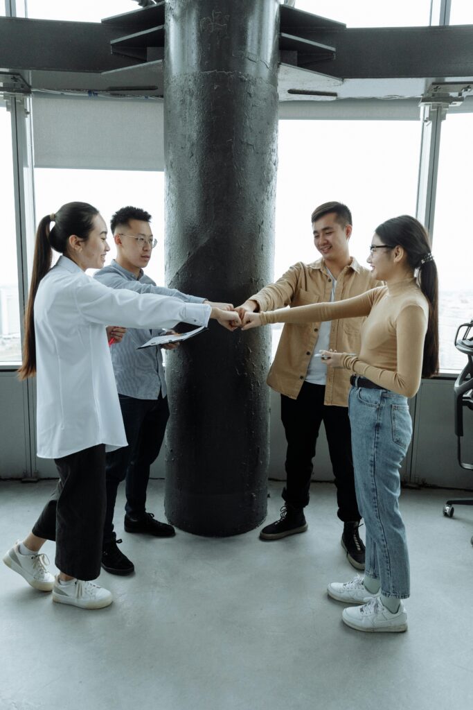 pexels-photo-7653770-7653770 A group of four young professionals collaborating in a contemporary office setting.